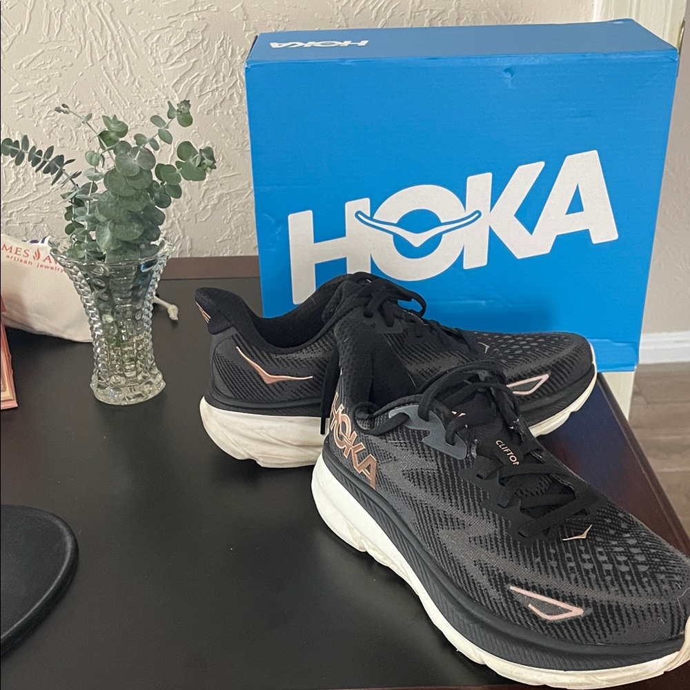 Hoka Women's Black and White Athletic Shoes   Free rhinestone on logo if wanted.